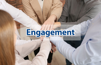 Image of Engagement concept. People holding hands together, above view 