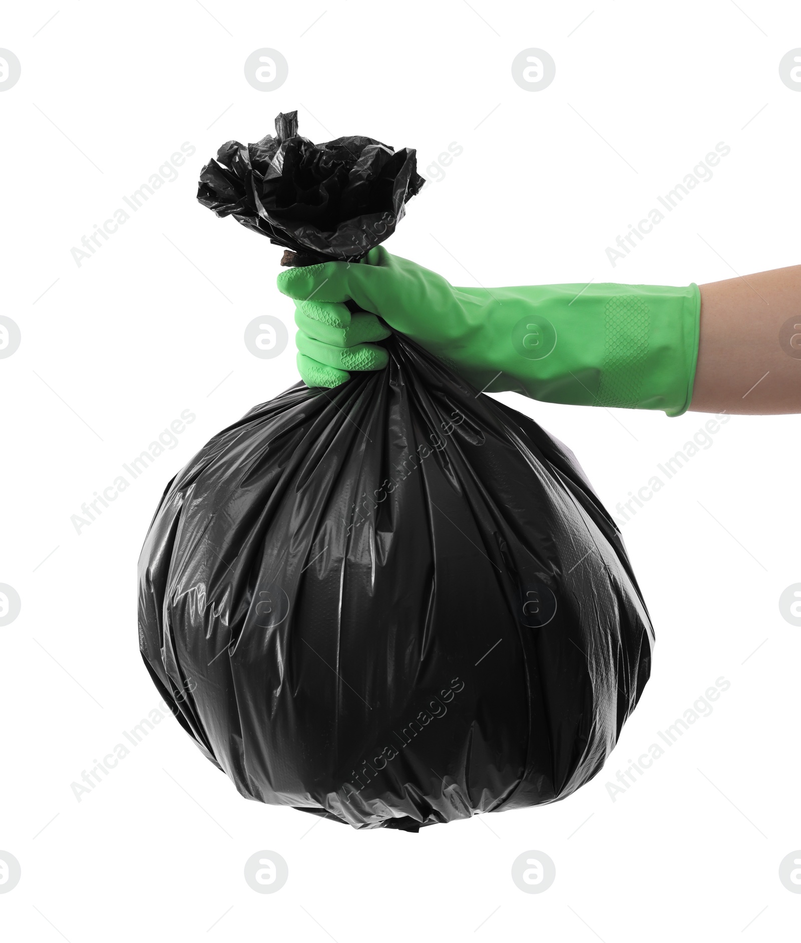 Photo of Woman holding plastic bag full of garbage on white background, closeup