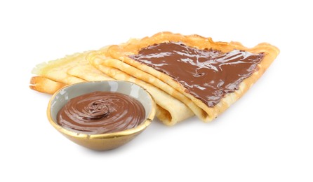 Tasty crepes with chocolate paste isolated on white