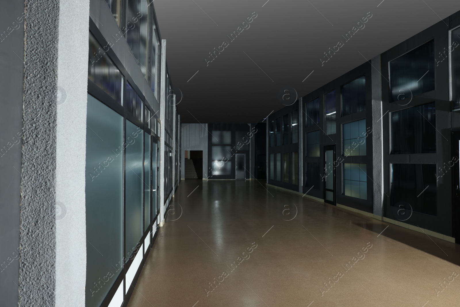 Photo of Modern empty office corridor with glass walls