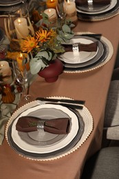 Photo of Table set with beautiful autumn decor for festive dinner
