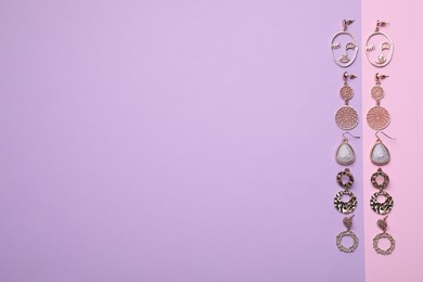 Photo of Different beautiful earrings on color background, flat lay. Space for text
