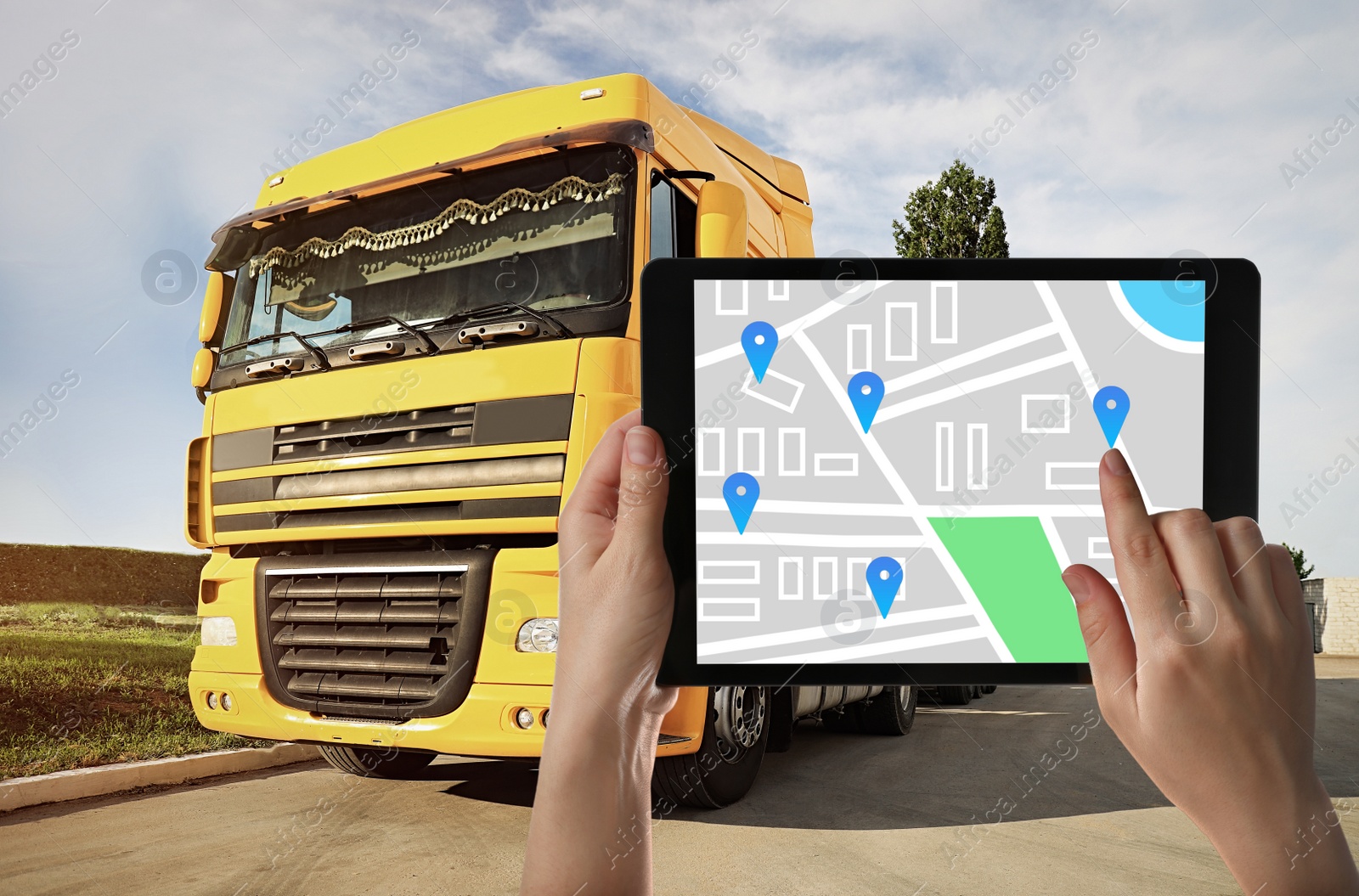 Image of Logistics concept. Woman using tablet with map on screen against truck