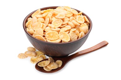 Bowl and wooden spoon with tasty corn flakes on white background