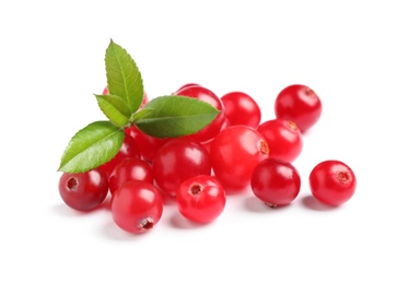 Pile of fresh ripe cranberries with leaves on white background