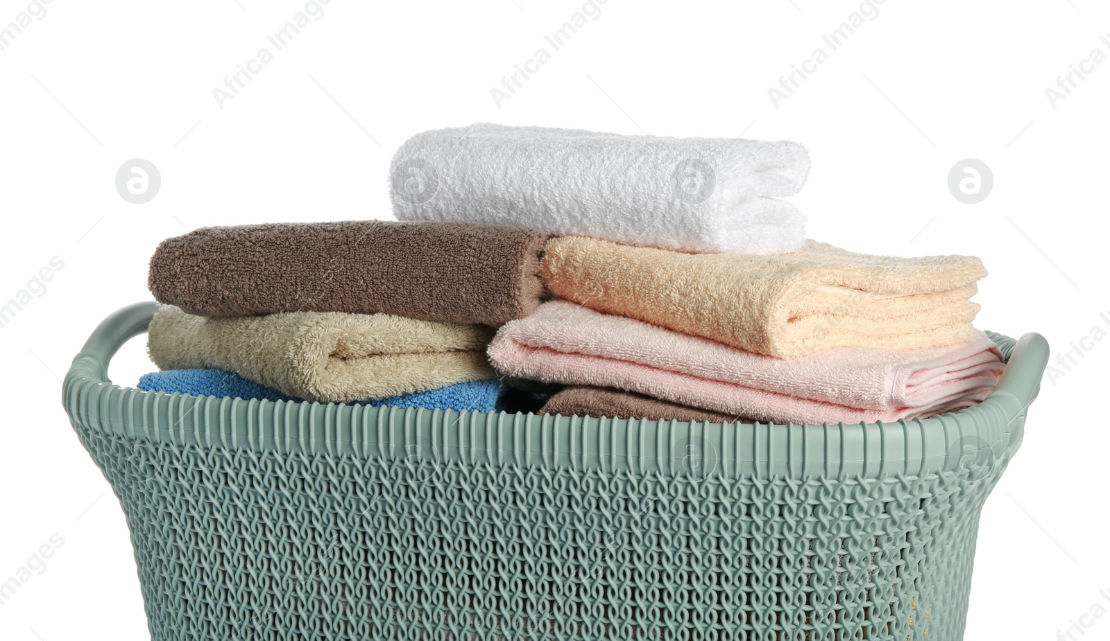 Photo of Plastic laundry basket with clean terry towels isolated on white