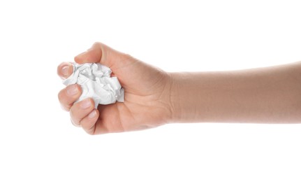 Photo of Woman holding crumpled paper ball on white background, closeup