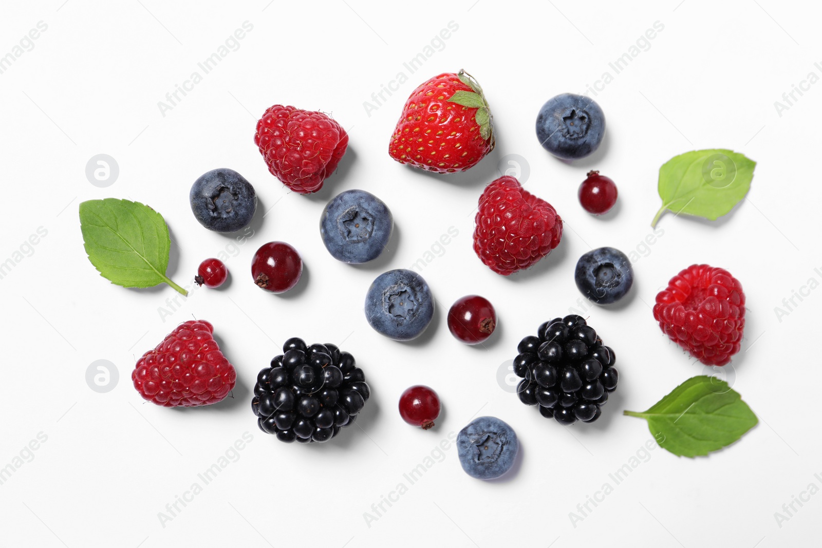 Photo of Many different fresh berries and mint leaves on white background, flat lay