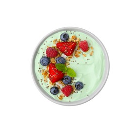 Tasty matcha smoothie bowl served with berries and oatmeal isolated on white, top view. Healthy breakfast