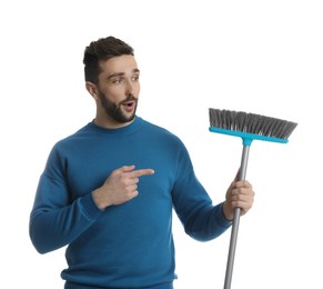 Emotional man with broom on white background