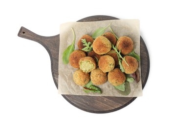 Delicious falafel balls with herbs on white background, top view