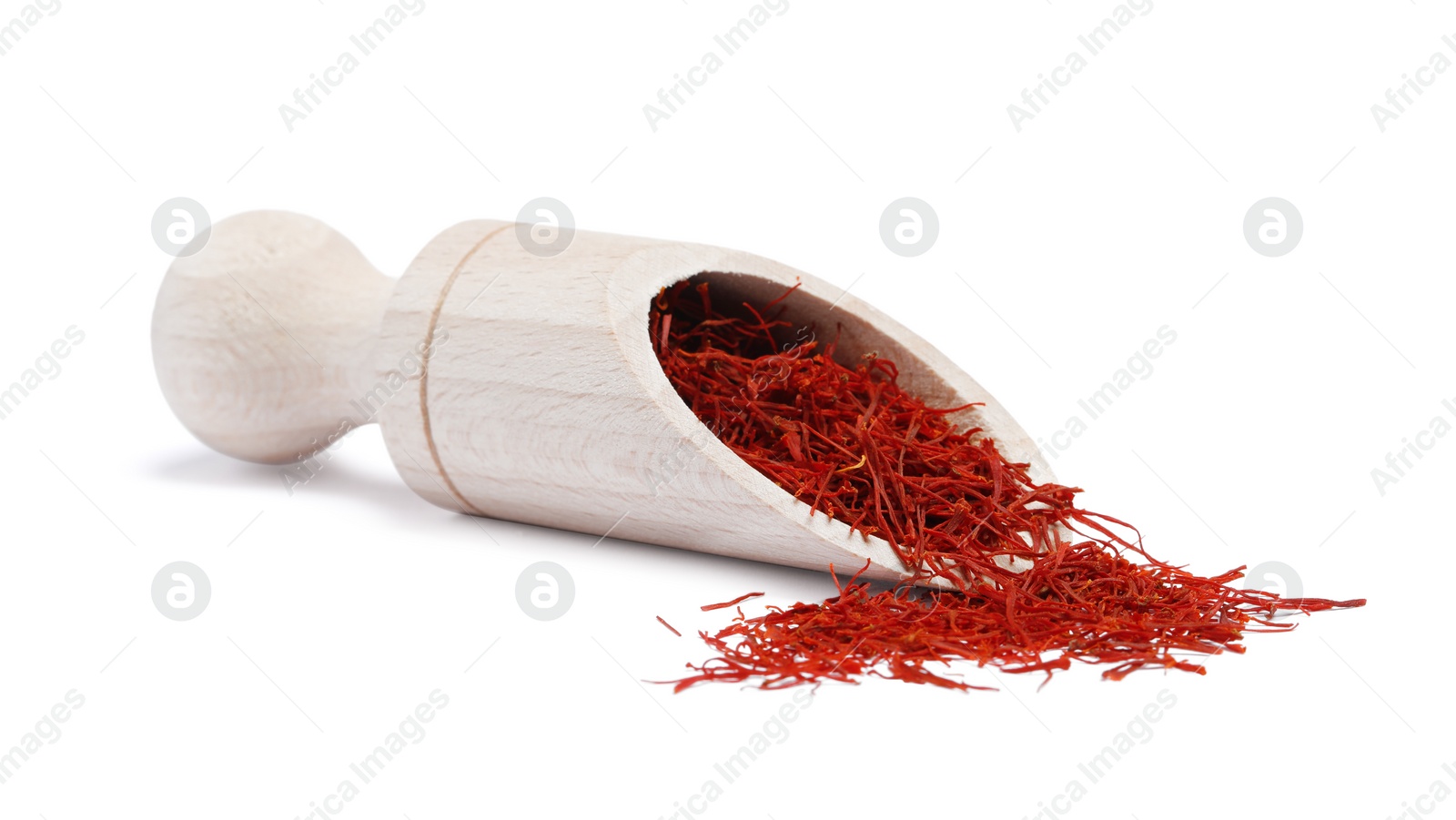 Photo of Aromatic saffron and scoop isolated on white