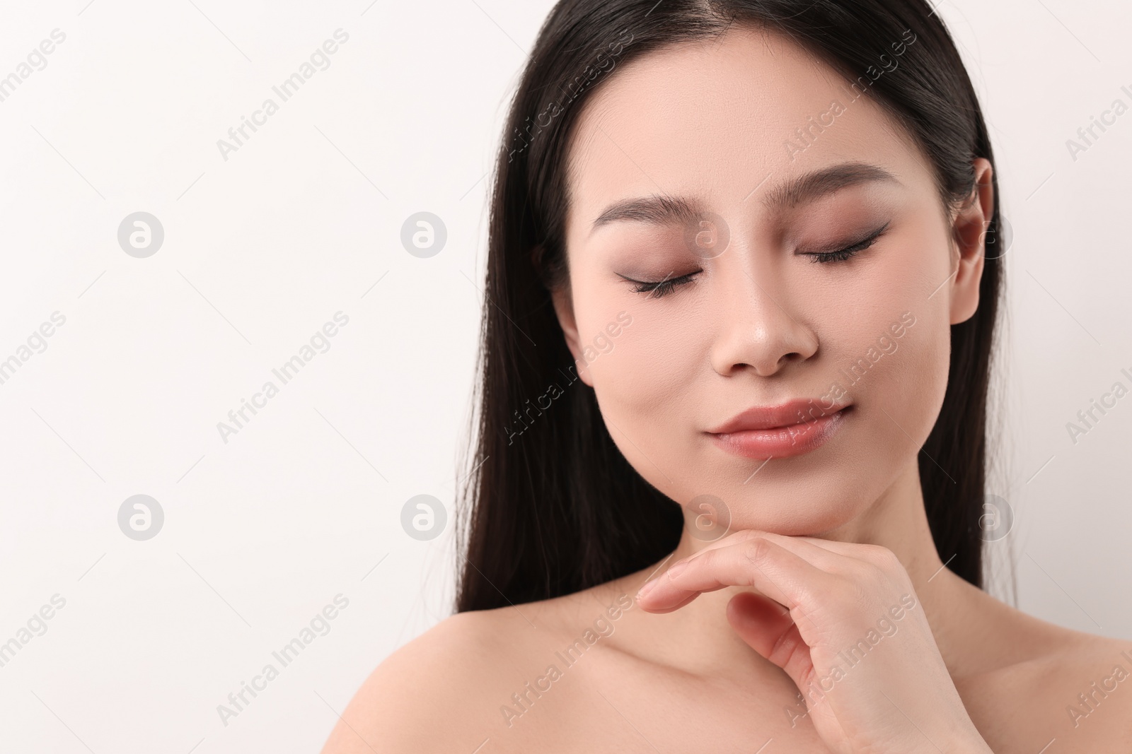 Photo of Portrait of beautiful woman on white background