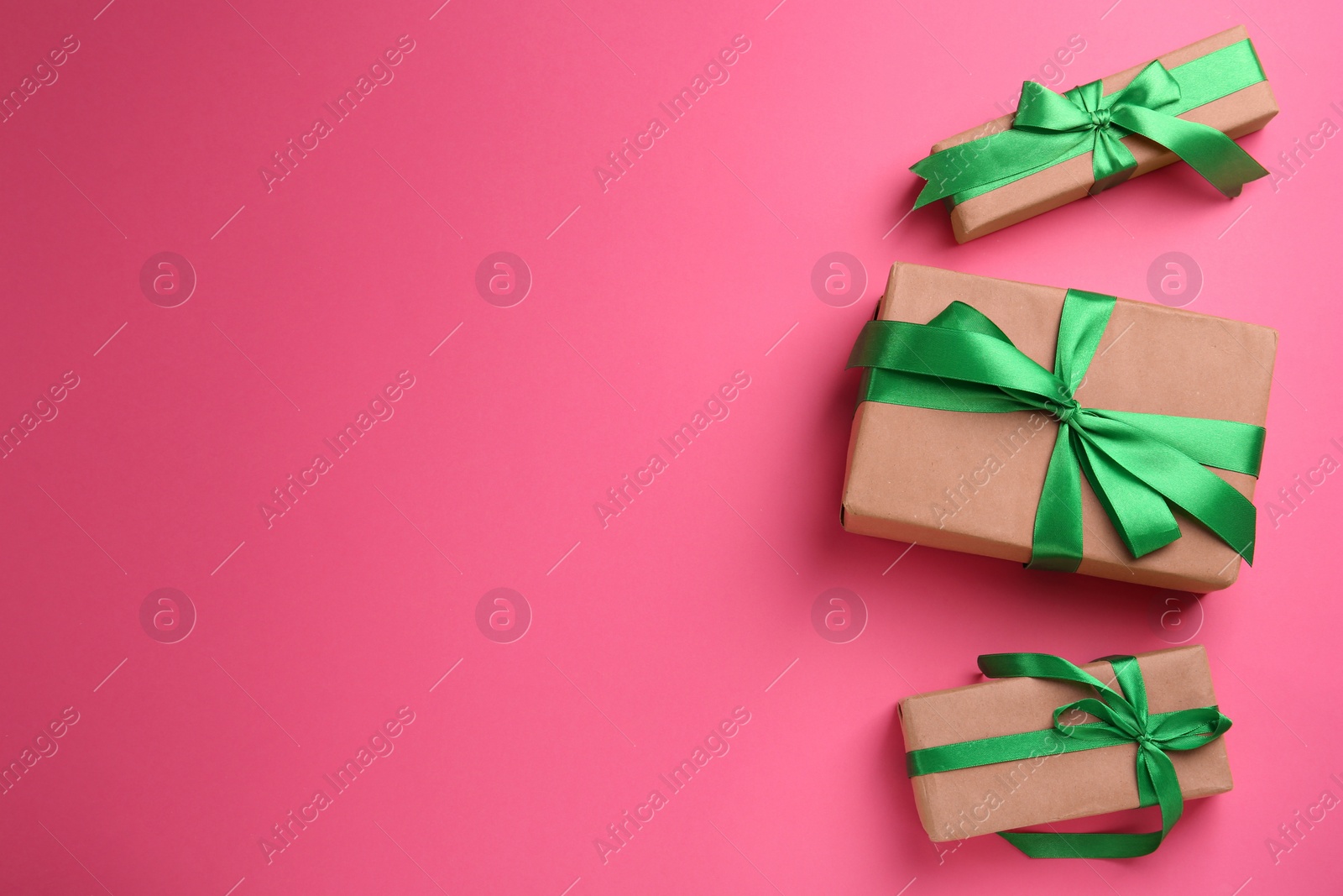 Photo of Many gift boxes on pink background, flat lay. Space for text