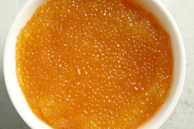 Photo of Fresh pike caviar in bowl on table, top view