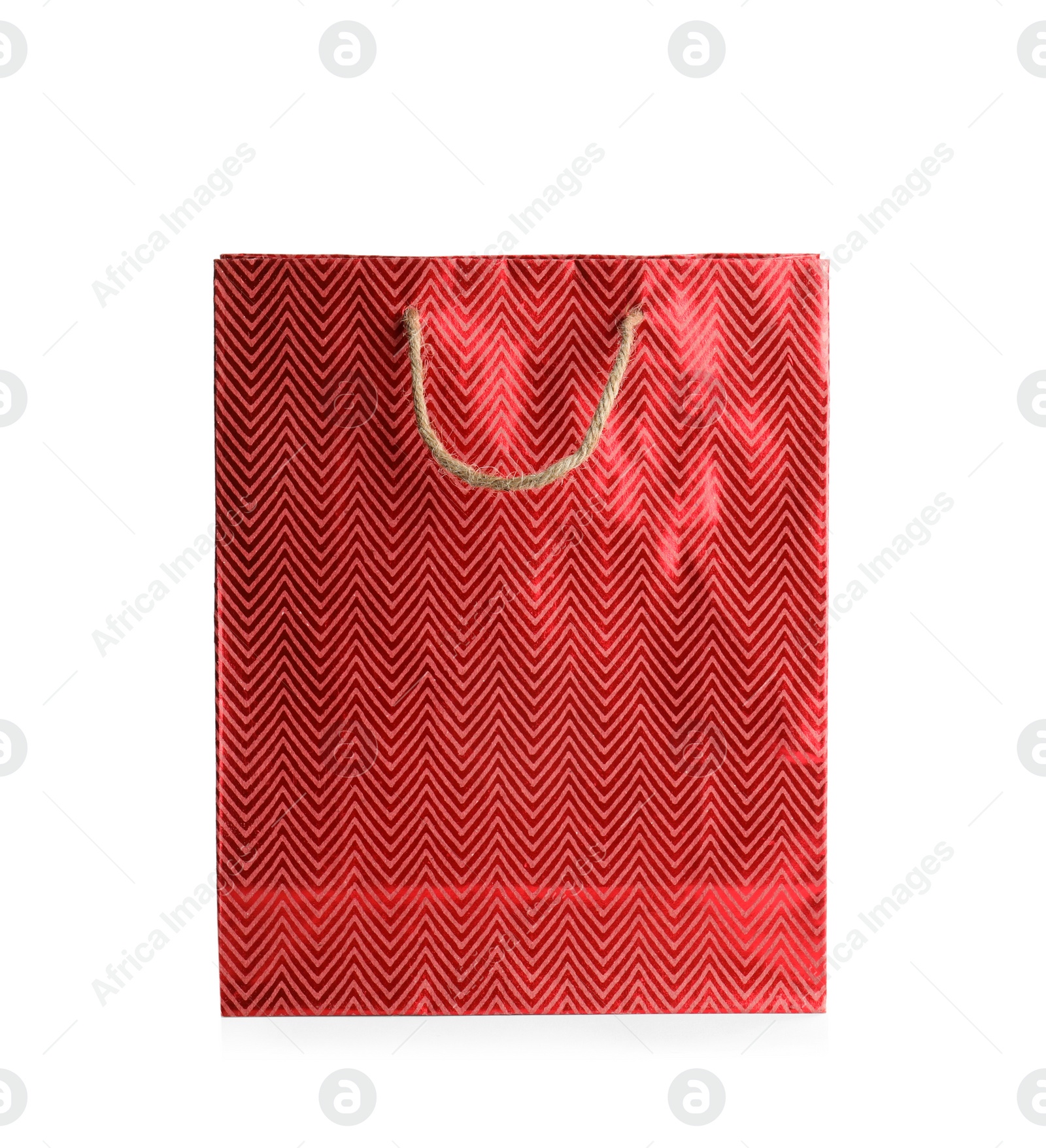 Photo of Red paper shopping bag isolated on white. Space for design