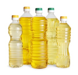 Bottles of cooking oil on white background