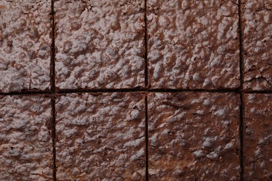 Closeup of delicious chocolate brownie as background, top view