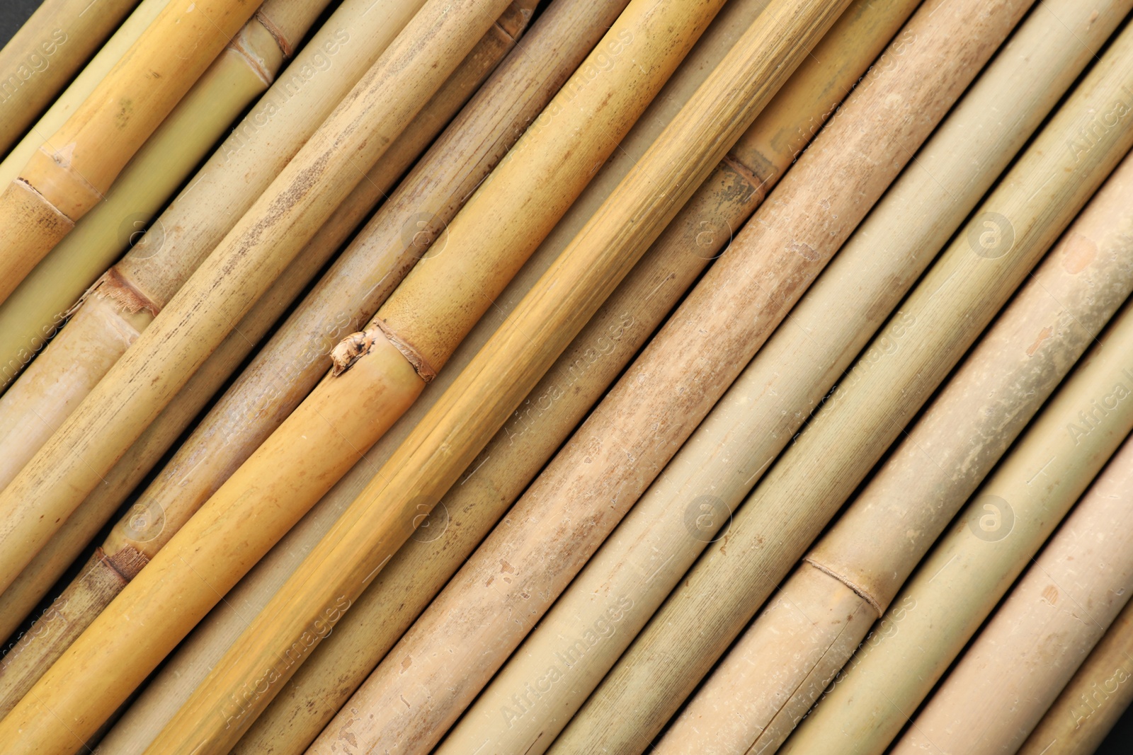 Photo of Dry bamboo sticks as background, top view