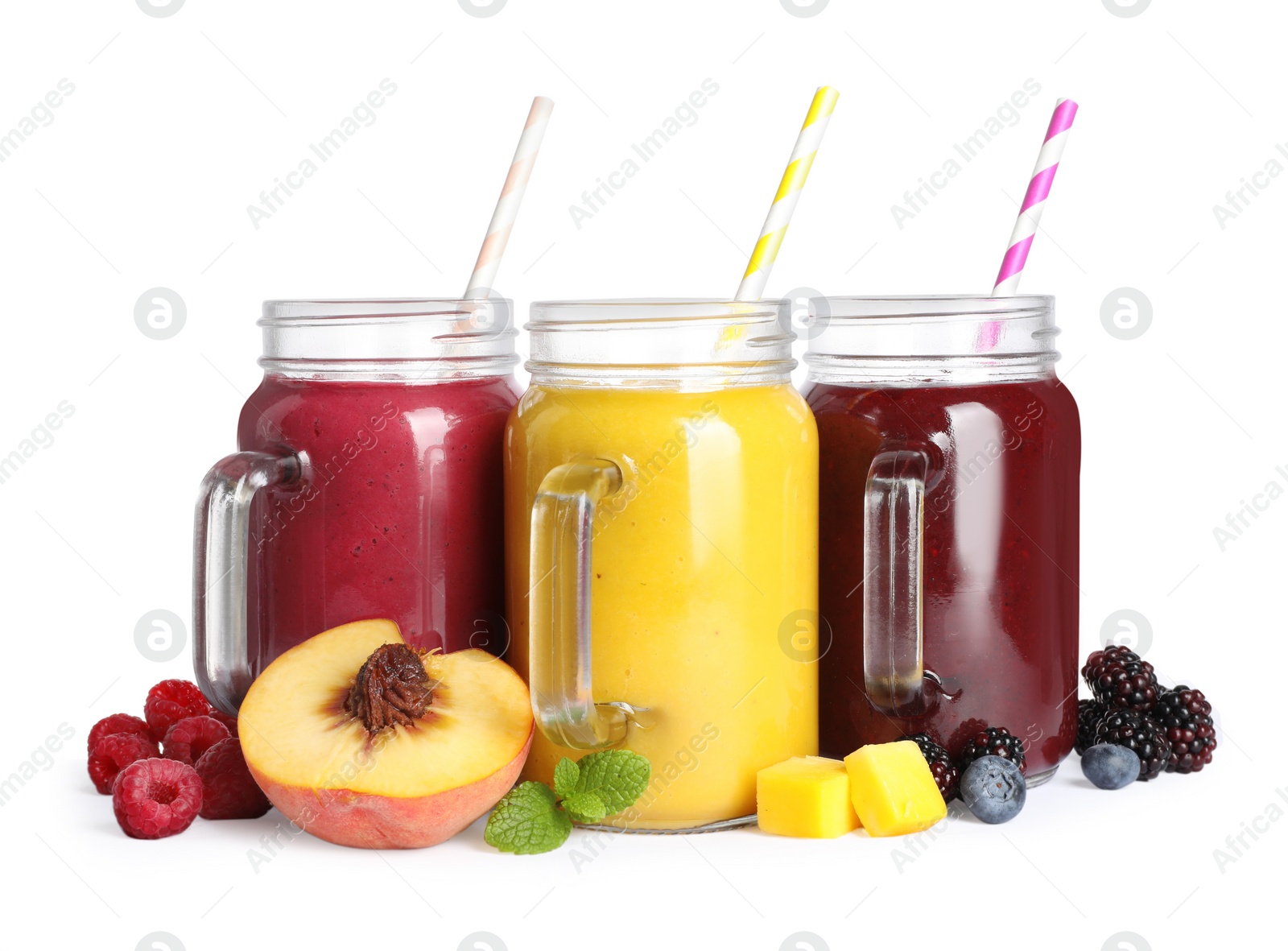 Photo of Different tasty smoothies in mason jars isolated on white