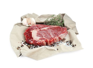 Photo of Piece of fresh beef meat, thyme and spices on white background