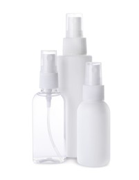 Photo of Spray bottles with antiseptic on white background