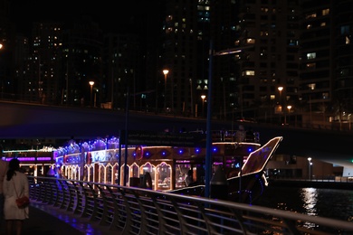 DUBAI, UNITED ARAB EMIRATES - NOVEMBER 03, 2018: Illuminated floating restaurant in marina district