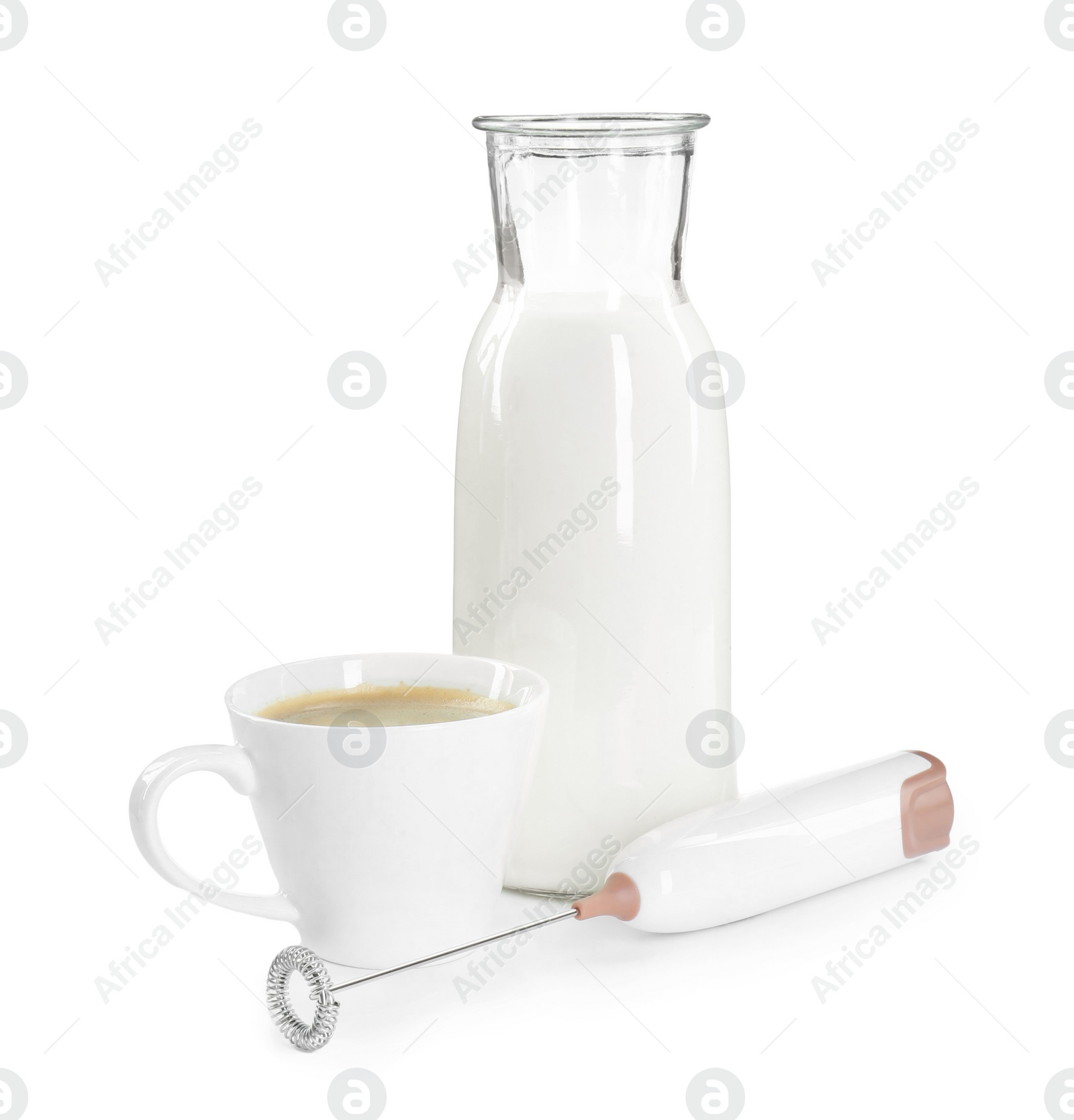 Photo of Mini mixer (milk frother), cup of coffee and bottle isolated on white