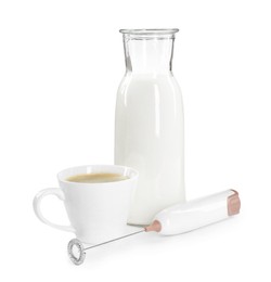 Mini mixer (milk frother), cup of coffee and bottle isolated on white