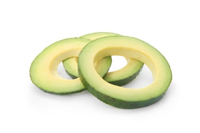 Slices of ripe avocado on white background