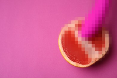 Image of Half of grapefruit and vibrator on purple background, flat lay with space for text. Sex concept