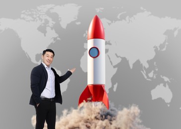 Global business startup. Happy man pointing at launching rocket against world map. Illustration of spaceship