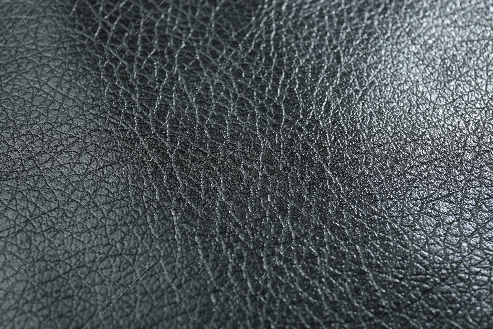 Photo of Texture of black leather as background, closeup