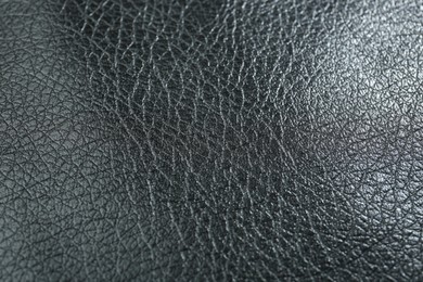 Photo of Texture of black leather as background, closeup