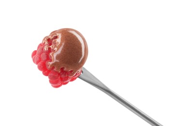 Photo of Raspberry with melted chocolate isolated on fondue fork against white background