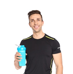 Portrait of man with bottle of protein shake on white background