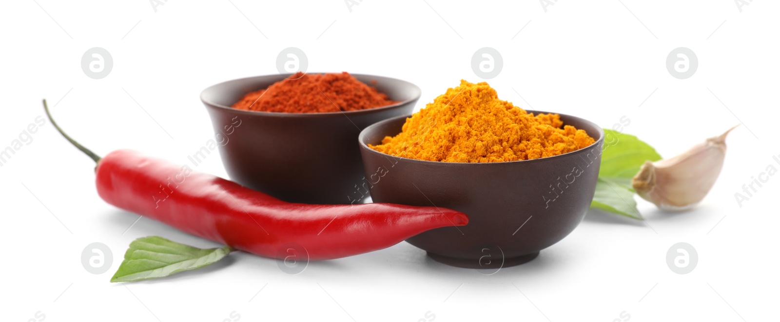 Photo of Different aromatic spices in bowls on white background