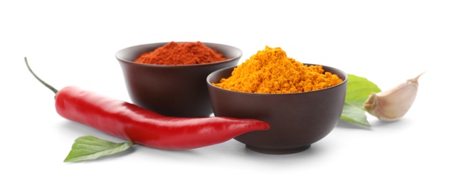 Photo of Different aromatic spices in bowls on white background