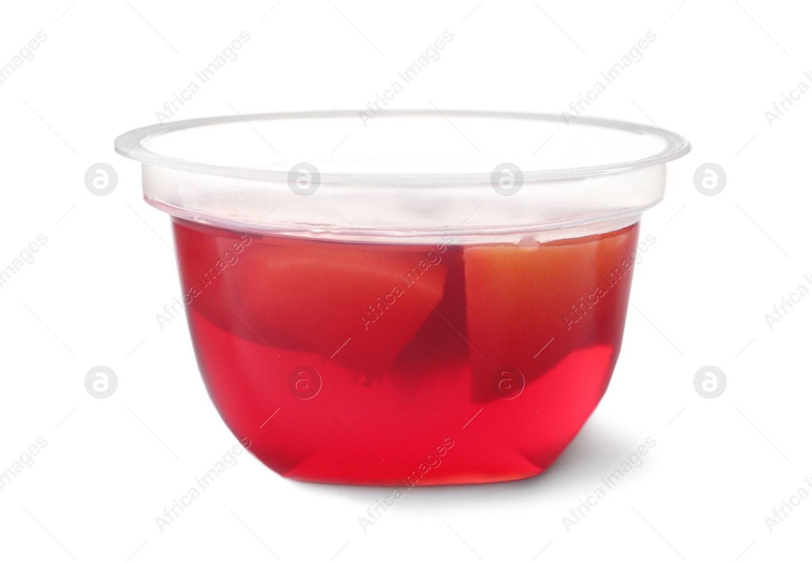 Photo of Tasty jelly dessert with slices of fruit in plastic cup on white background