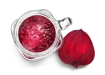 Mason jar of beet smoothie on white background, top view