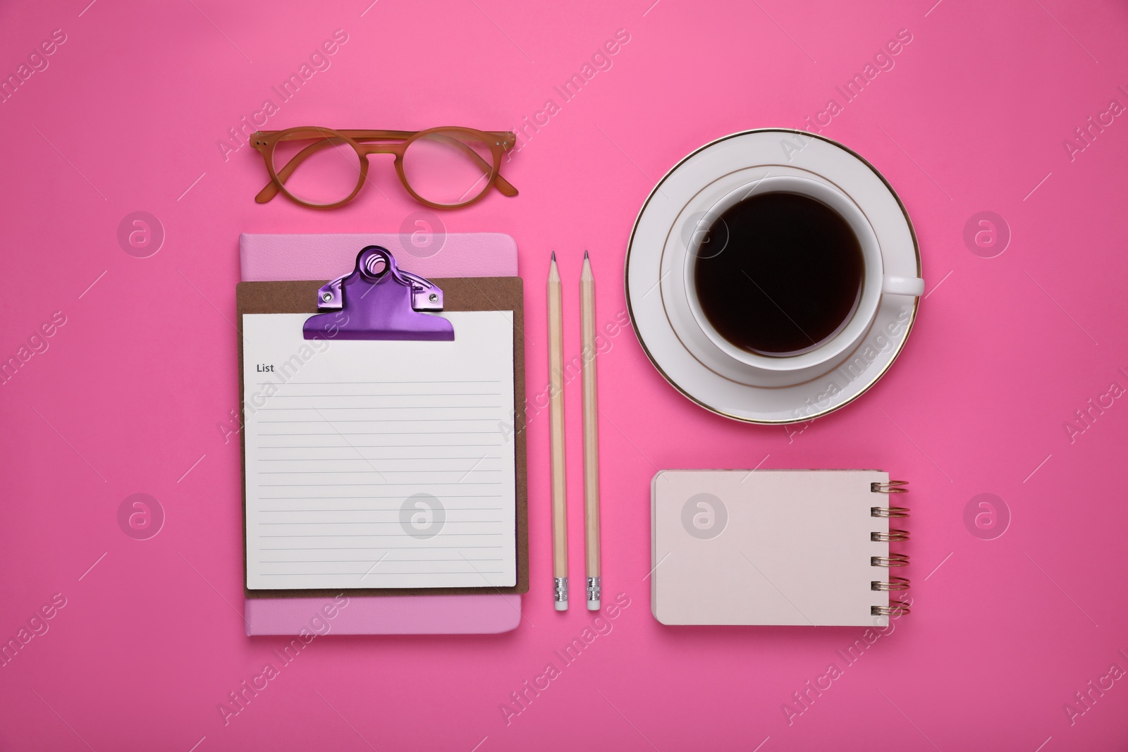 Photo of To do notes, stationery, planner and cup of coffee on pink background, flat lay. Space for text