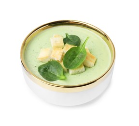 Delicious spinach cream soup with croutons in bowl isolated on white