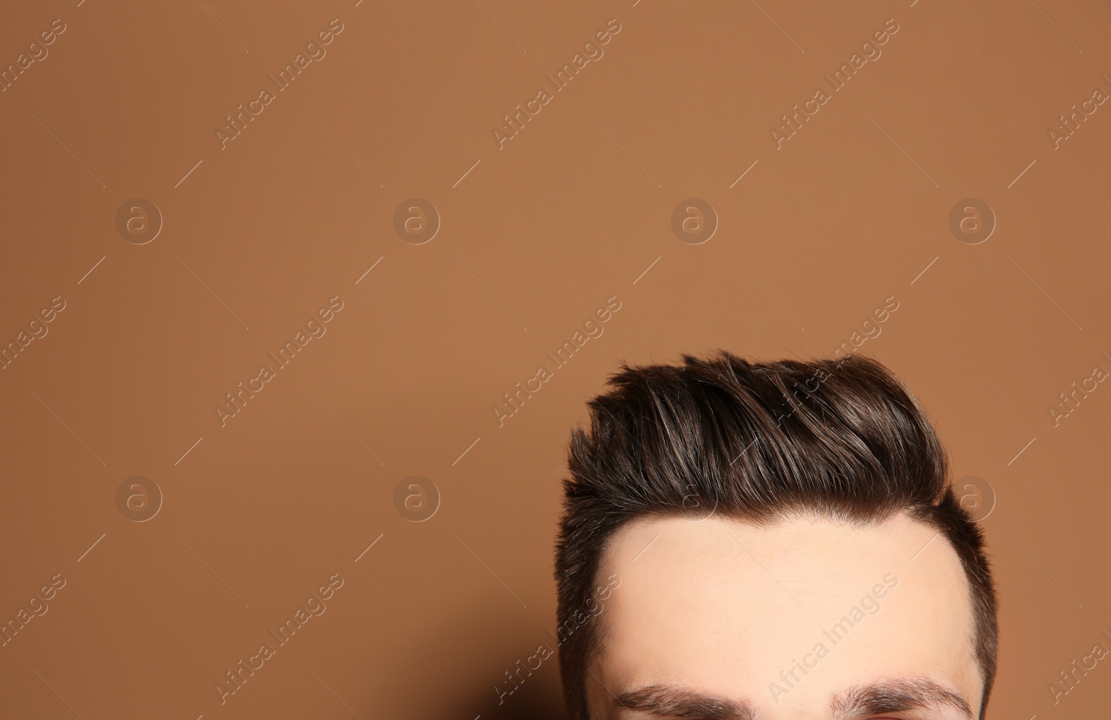 Photo of Young man with hair loss problem on color background