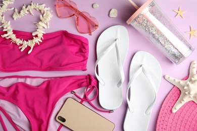 Photo of Flat lay composition with beach objects on lilac background