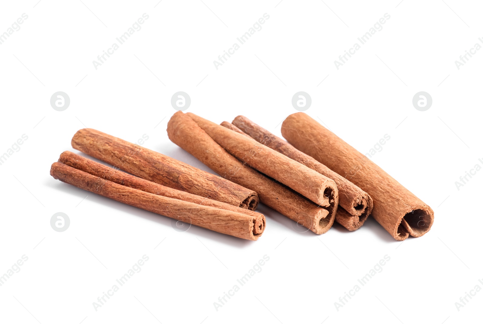 Photo of Dry aromatic cinnamon sticks isolated on white