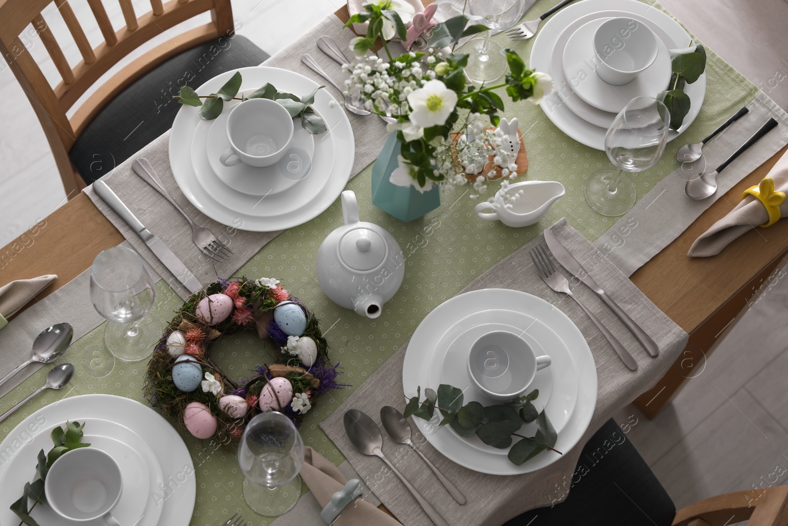 Photo of Beautiful Easter table setting with festive decor indoors, above view