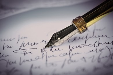 Image of Writing letter with fountain pen, closeup view