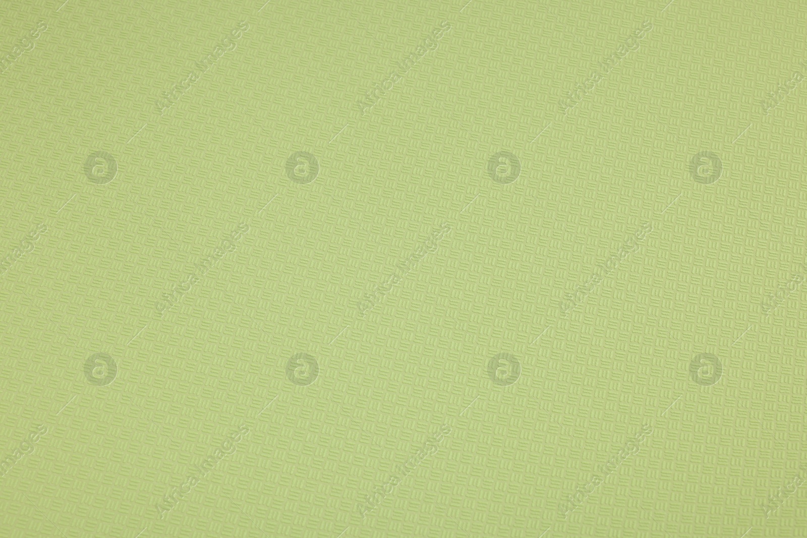 Photo of Stylish green wallpaper as background, closeup view