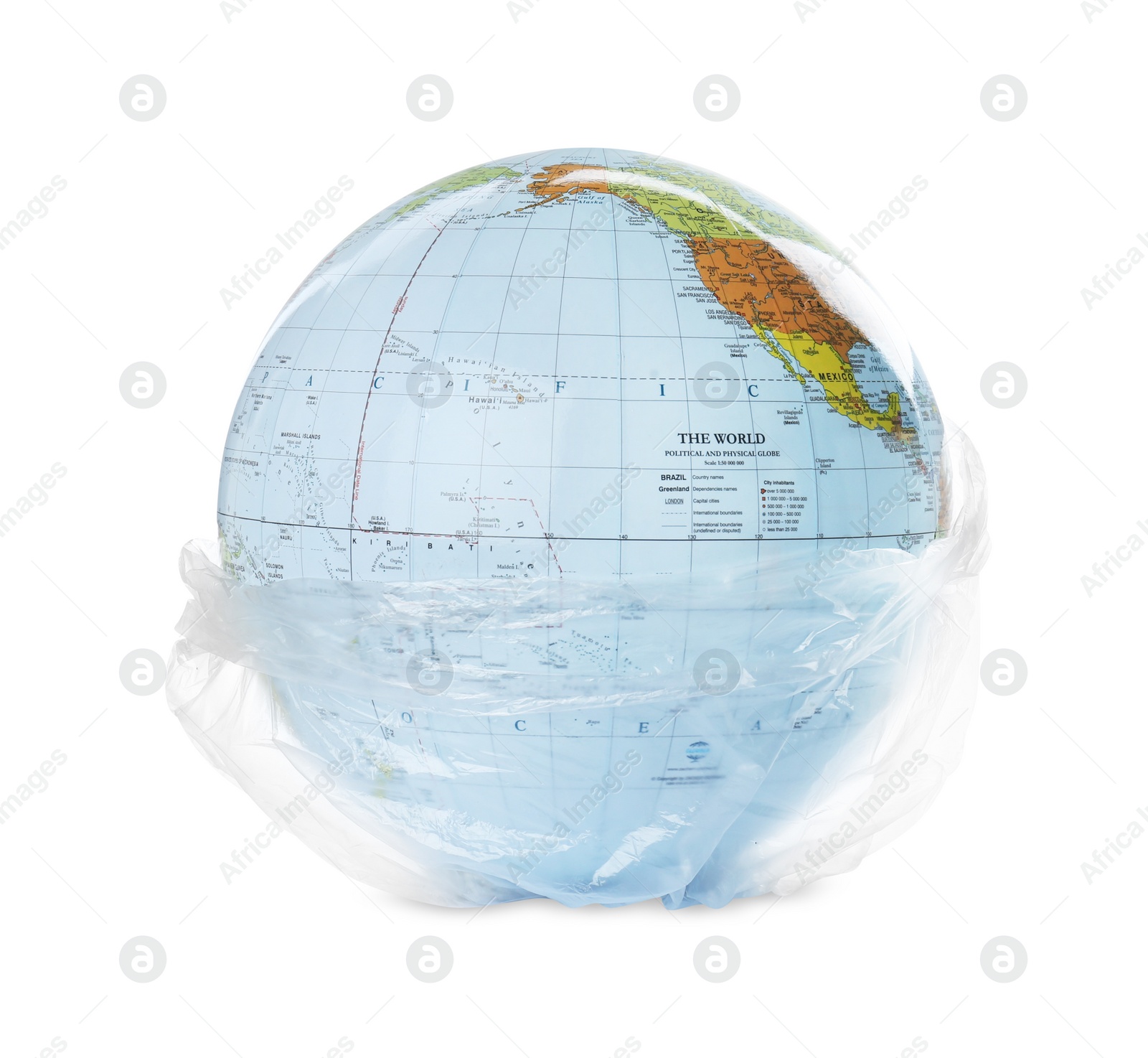 Photo of Globe in plastic bag isolated on white. Environmental conservation