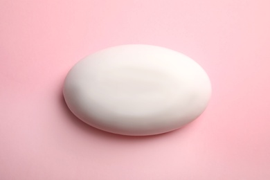 Soap bar on color background, top view